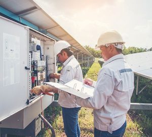inverter for business - Engineer doing Maintenance on Industry Solar Power
