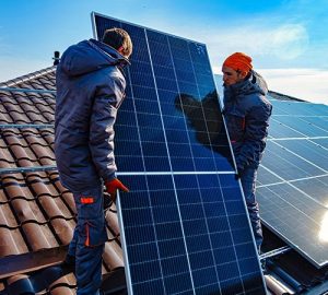 Two men on roof Installing Solar Panels